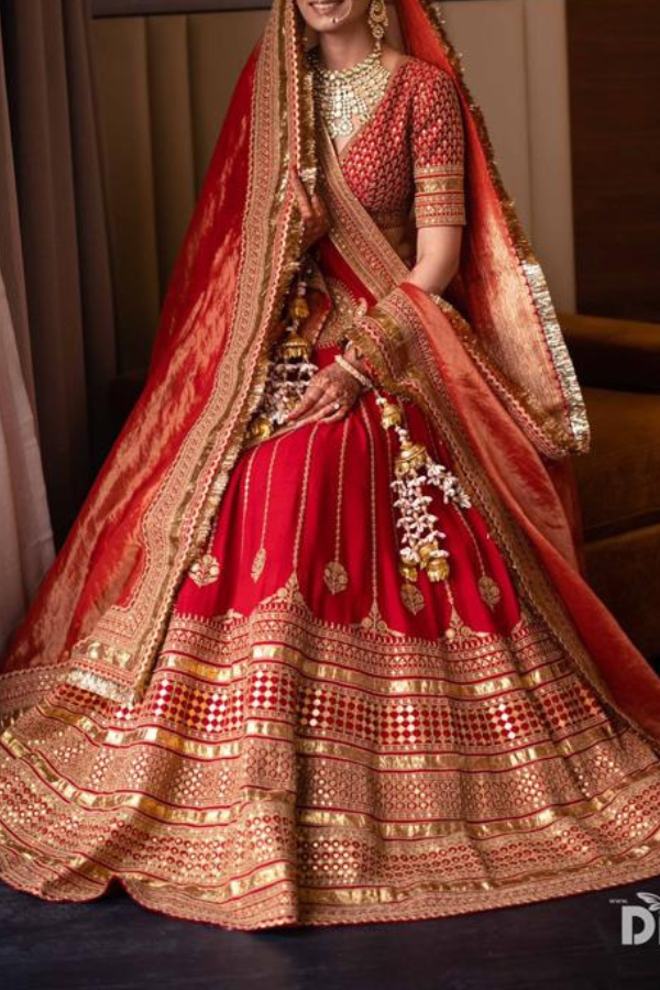 Red and green bridal lehenga sabyasachi clearance