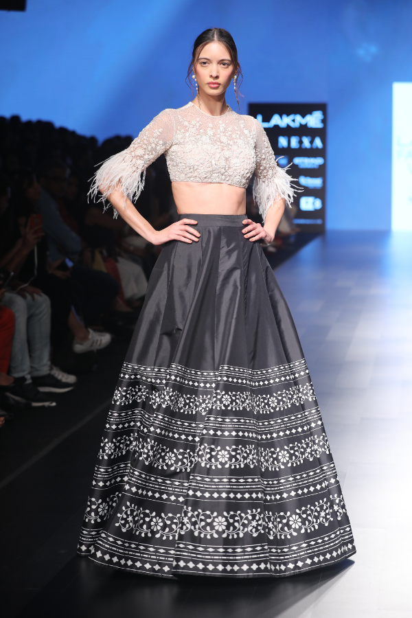 RIDHI MEHRA white top and black skirt set