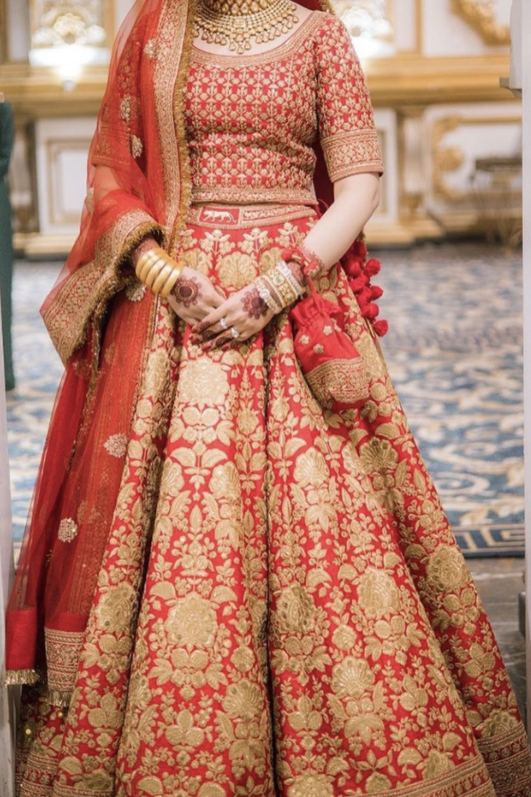 Couple wedding outfits by Sabyasachi. | Sabyasachi bridal red, Bridal  lehenga red, Sabyasachi bridal