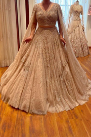 dolly J Shimmer Tulle Gold Lehenga Set