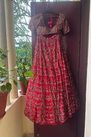 Astha narang red embridered lehenga set