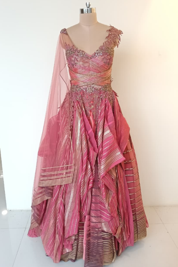 Shanthanu and Nikhil pink layered gown