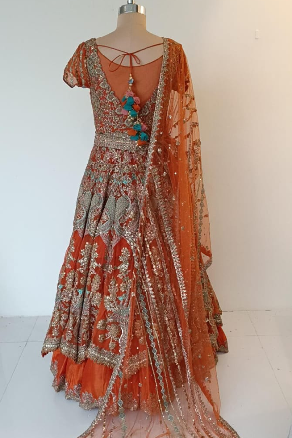 Rimple & Harpreet Orange Embroidered Bridal Lehenga Set