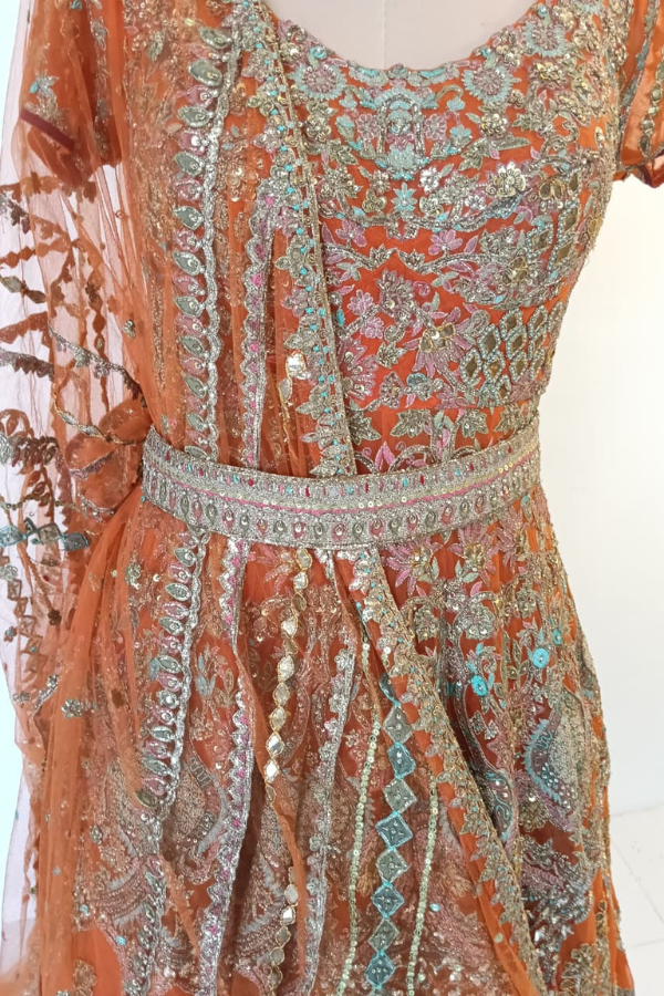 Rimple & Harpreet Orange Embroidered Bridal Lehenga Set