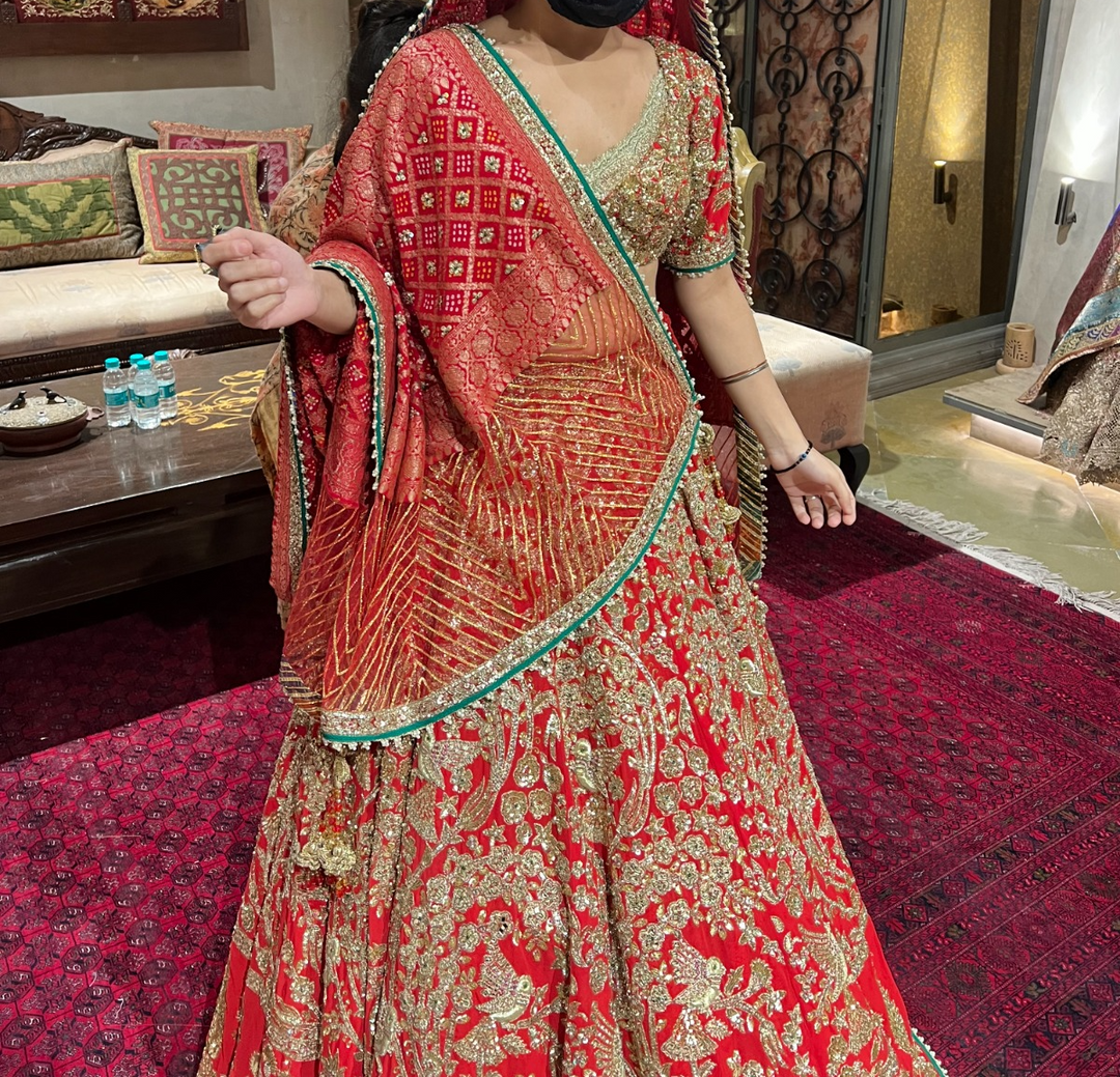 Rimple & Harpreet Red & Gold Embroidered Lehenga Set