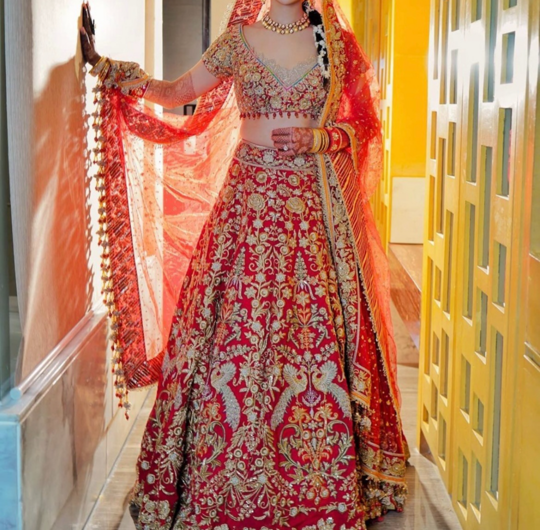 Rimple & Harpreet Red Embroidered Bridal Lehenga Set