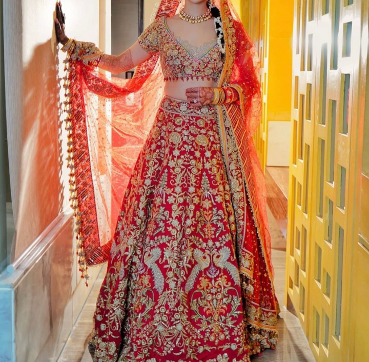 Rimple & Harpreet Red Embroidered Bridal Lehenga Set