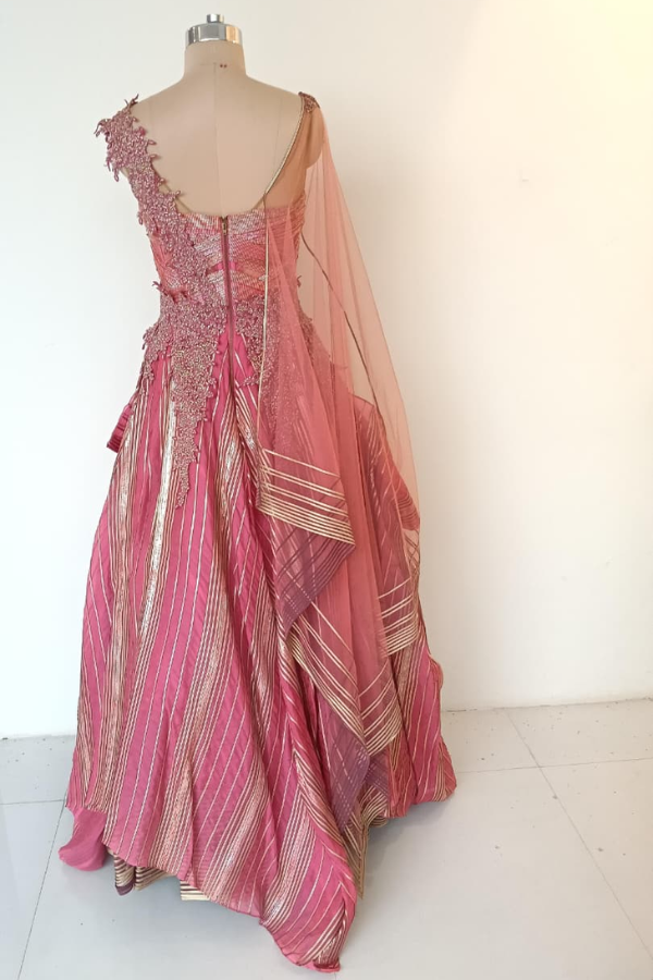 Shanthanu and Nikhil pink layered gown