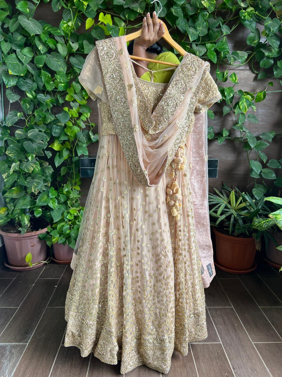 Sabyasachi Peach Net Lehenga Set