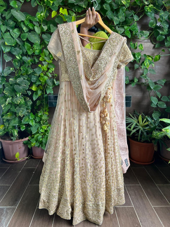 Sabyasachi Peach Net Lehenga Set