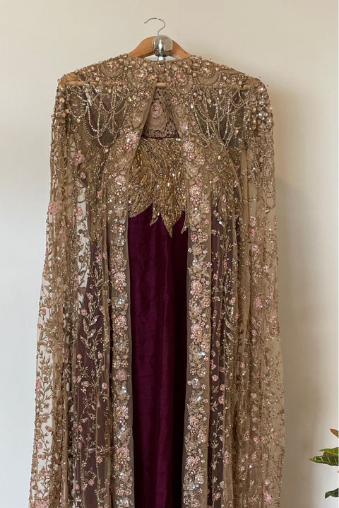 Gown with beige embellished cape